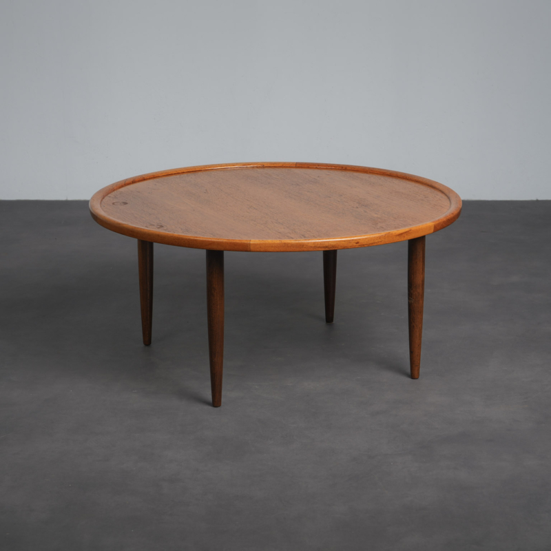 Scandinavian modern round teak coffee table from Denmark, 1960s, three-quarter view