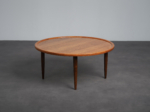 Scandinavian modern round teak coffee table from Denmark, 1960s, opposite three-quarter view